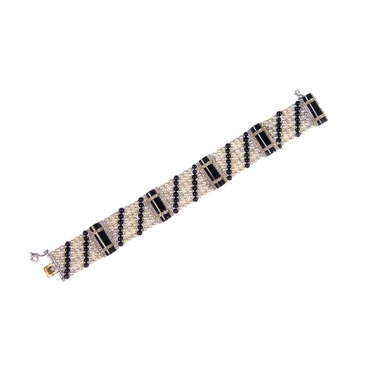 Early 20th century onyx, diamond and pearl strap bracelet